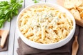 Penne pasta cream cheese on wooden background