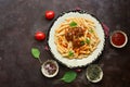 Penne pasta with meatballs in tomato sauce on a dark rustic background. Top view, flat lay, copy space Royalty Free Stock Photo