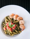 Penne Pasta with Pesto Sauce, shrimps tomato. Italian Cuisine. T Royalty Free Stock Photo