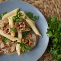 Penne pasta with pork meat and chanterelle mushroom. Royalty Free Stock Photo