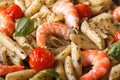 Penne pasta with shrimp, tomato and pesto macro. horizontal Royalty Free Stock Photo