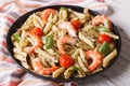 Penne pasta with shrimps, tomato and pesto closeup. horizontal Royalty Free Stock Photo