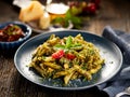 Penne pasta with spinach and chicken, sprinkled with parmesan cheese and fresh parsley Royalty Free Stock Photo