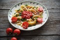 Penne pasta in tomato sauce with chicken, tomatoes decorated parsley Royalty Free Stock Photo