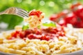 Penne pasta with tomato sauce on a fork Royalty Free Stock Photo