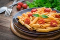 Penne pasta in tomato sauce on plate Royalty Free Stock Photo