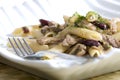 penne with pork pieces and champignons Royalty Free Stock Photo