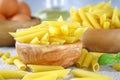 Penne rigate. Macaroni in the form of feathers. mostaccioli pasta. Royalty Free Stock Photo