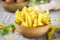 Penne rigate. Macaroni in the form of feathers. mostaccioli pasta. Royalty Free Stock Photo