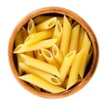 Penne rigate pasta in wooden bowl over white Royalty Free Stock Photo