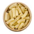 Penne rigate pasta in wooden bowl. Uncooked dried durum wheat semolina Royalty Free Stock Photo