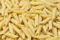 Pennette rigate. Background of raw pasta Royalty Free Stock Photo