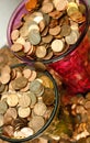 Pennies collected in big glass vases, overflowing coin shortage Royalty Free Stock Photo