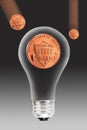 Pennies and light bulb Royalty Free Stock Photo