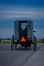 Pennsylvania, USA, APRIL, 18, 2018: Outdoor view of the back of an old fashioned, Amish buggy with people inside and a