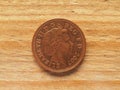 1 penny coin, obverse side showing the Queen, currency of the UK