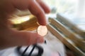 Penny In Hand Zoom Burst With Stacks Of Hundreds & Gold Bar High Quality Royalty Free Stock Photo