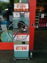 Penny pressing machine Essentially Seattle in front of store