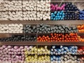 Pens and markers neatly arranged on a shelf in a stationery shop. Colorful and unique