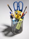 Pens, pencils, scissors and brushes in a pot