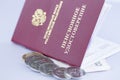 Pension certificate with coins isolated closeup on white background open