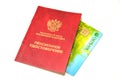 A pension certificate and a plastic card of Sberbank of Russia on a white background. Russian text - pension certificate, Sberbank