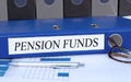 Pension Funds - blue binder in the office Royalty Free Stock Photo
