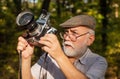 Pension hobby. Experienced photographer. Vintage camera. Old man shoot nature. Professional photographer. Make perfect Royalty Free Stock Photo