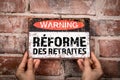 PENSION REFORM in French. Warning sign with text Royalty Free Stock Photo