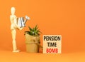 Pension time bomb symbol. Concept words Pension time bomb on wooden blocks on a beautiful orange table orange background.