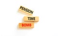 Pension time bomb symbol. Concept words Pension time bomb on wooden blocks on a beautiful white table white background. Business