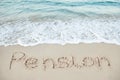 Pension written on sand by sea Royalty Free Stock Photo