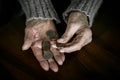 Pensioner counting money into her hands Royalty Free Stock Photo