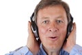 Pensioner with headphones singing to mp3 music