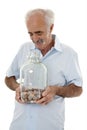 Pensioner looking at his savings