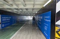 A pensioner male looks around at signage in an underground bikeway along the Brisbane River