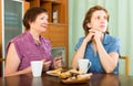 Pensioner mother and her daughter tea-drinking Royalty Free Stock Photo