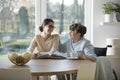 Pensioner and nurse sitting together Royalty Free Stock Photo