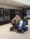 Pensioner sitting on a mobility scooter