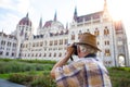 Pensioner tourist capturing Hungarian Parliament, Hungary Royalty Free Stock Photo