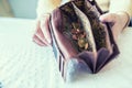 Pensioner woman holding in hands wallet with euro coins Royalty Free Stock Photo