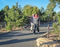 Pensioners with a dog on an evening walk in the Grand Canyon National Park. USA. Spring 2015