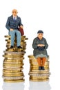 Pensioners and pensioner on money stack Royalty Free Stock Photo