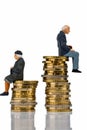 Pensioners and pensioner sitting on pile of money