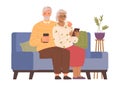 Pensioners sitting on sofa using smartphones
