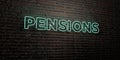 PENSIONS -Realistic Neon Sign on Brick Wall background - 3D rendered royalty free stock image