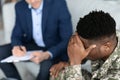 Pensive african american soldier attending psychotherapist at clinic, top view Royalty Free Stock Photo