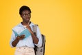 Pensive african american teen lady student, think, dream, make writes in diary Royalty Free Stock Photo