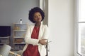 Pensive african american woman office worker standing and looking at camera Royalty Free Stock Photo