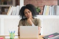 Pensive black woman work at laptop thinking making decision Royalty Free Stock Photo